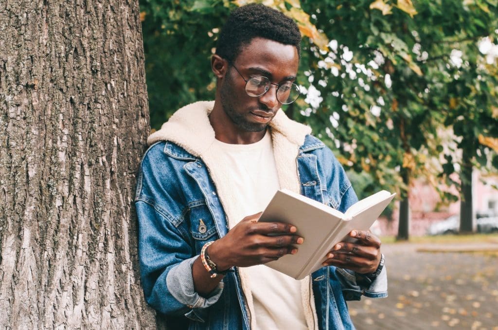 student reading outside